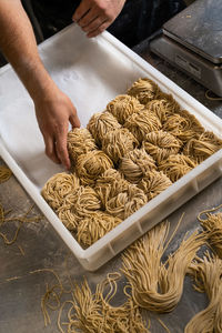 Cropped image of man preparing food for sale at market