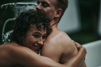 Couple in bathtub outdoors