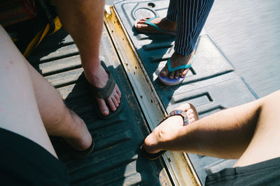 Low section of man holding hands