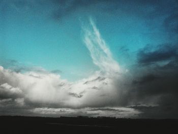 Scenic view of landscape against cloudy sky