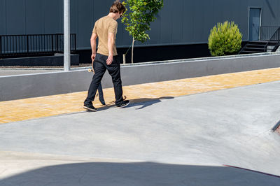 Rear view of man standing on street