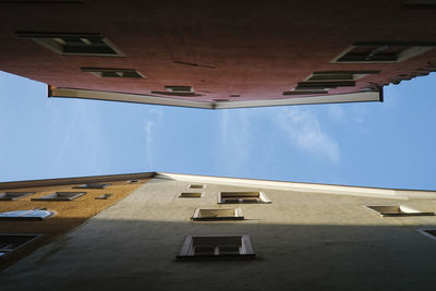 Directly below shot of building against sky
