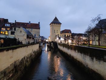 Canal passing through city buildings