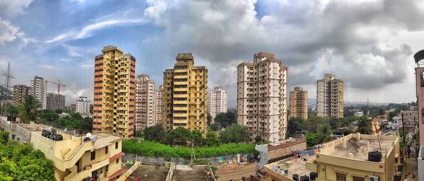High angle view of buildings in city against sky