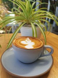 Close-up of coffee cup on table