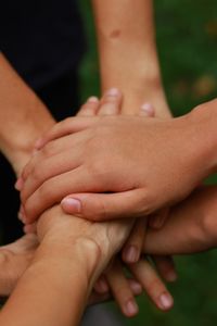 Close-up of hands touching feet