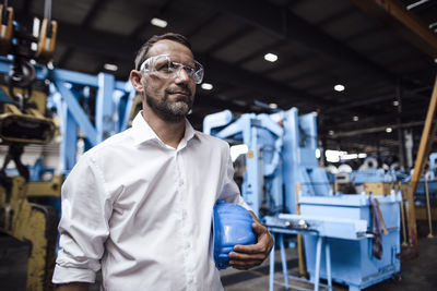 Portrait of man working in factory