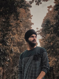 Portrait of young man looking away