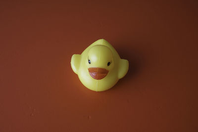 Close-up of a toy over yellow background