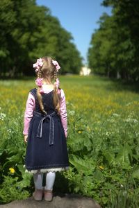 Full length of woman standing on field