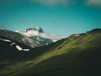 Scenic view of snowcapped mountains against sky