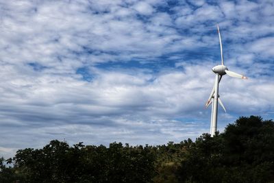 Low angle view of wind turbine against sky