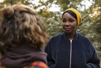 Woman talking to friend