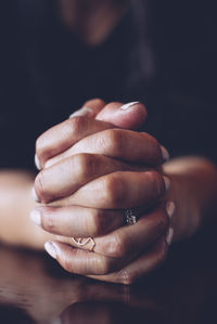 Woman with clasped hands