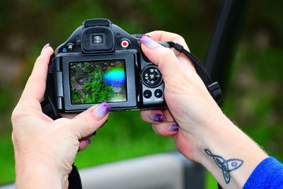 Close-up of hand holding camera