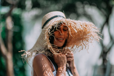 Portrait of smiling young woman outdoors