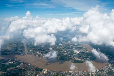 Aerial view of cityscape against sky