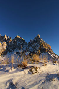 Italy, dolomities unesco heritage. scenic view of snowcapped  montains against clear sky. 