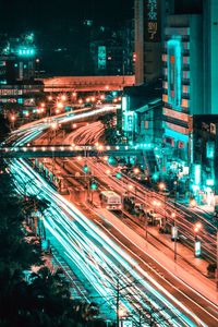 High angle view of light trails on road at night