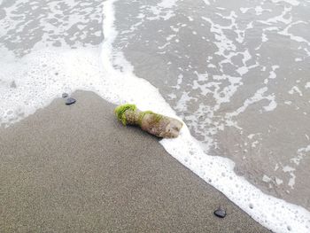 High angle view of wet sand on beach