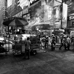 People on street in city at night