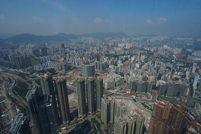 Aerial view of modern buildings in city against sky