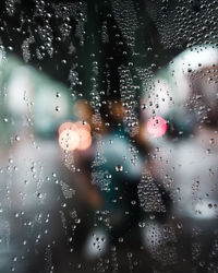 Full frame shot of raindrops on glass window