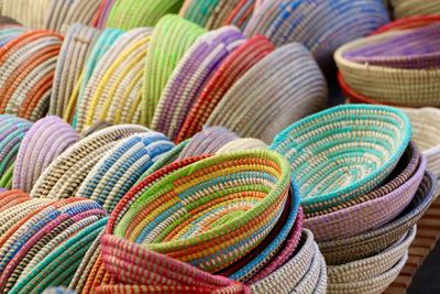 Close-up of multi colored baskets for  sale at market stall
