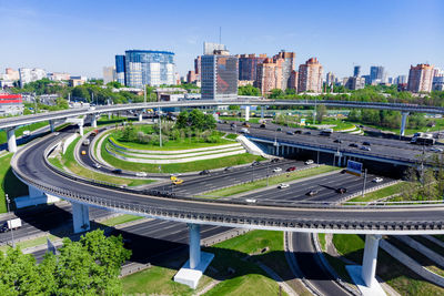 High angle view of road amidst buildings in city against sky