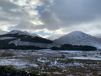 Scenic view of snowcapped mountains against sky