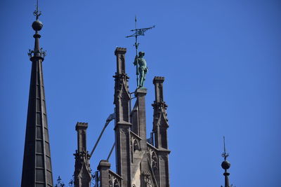 Low angle view of new town hall against blue sky