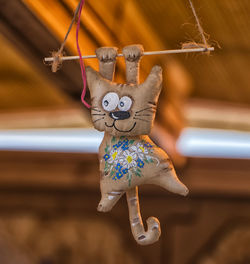 Low angle view of toy hanging on clothesline