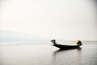 Boat in sea against clear sky