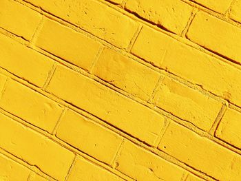 Full frame shot of yellow brick wall