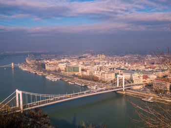 High angle view of bridge over river against cloudy sky