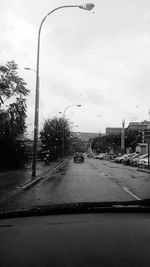 Cars on wet street in rainy season