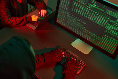 Midsection of man using laptop