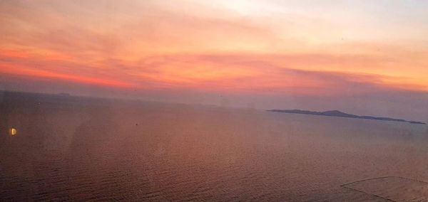 Scenic view of landscape against sky during sunset