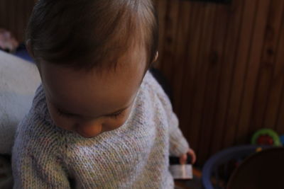 Close-up of cute boy standing at home