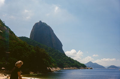 Scenic view of  sugarloaf and ocean against sky