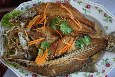 High angle view of fish in plate on table