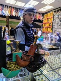 Full length of young man looking at store