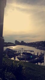 Scenic view of river against sky during sunset