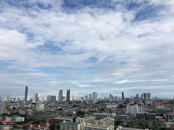 Modern buildings in city against sky