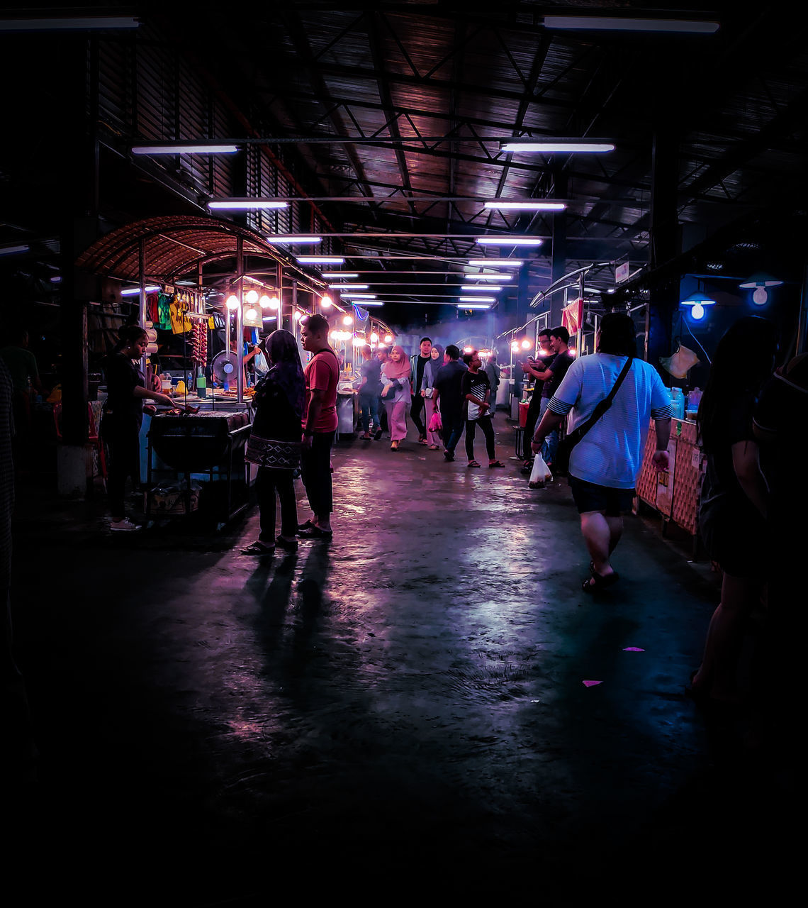 GROUP OF PEOPLE WALKING IN MARKET