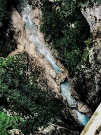 High angle view of water flowing through rocks