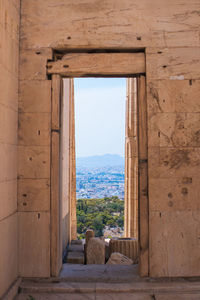 Acropoli's view of athens through an ancient door