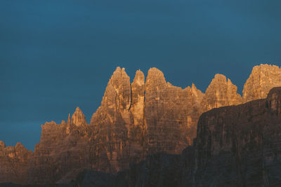 Low angle view of rock formations against sky