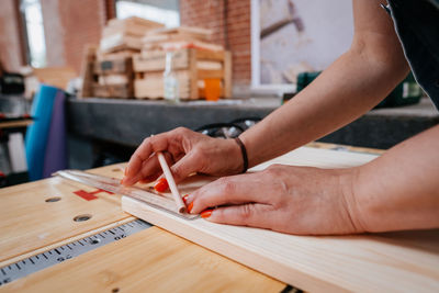 Close-up of man working on table