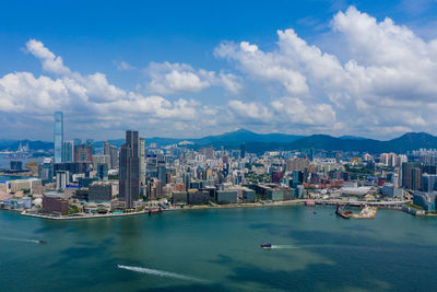 Panoramic view of sea and buildings against sky